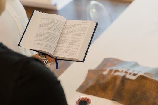 Closeup of a religious ceremony featuring scripture reading indoors.